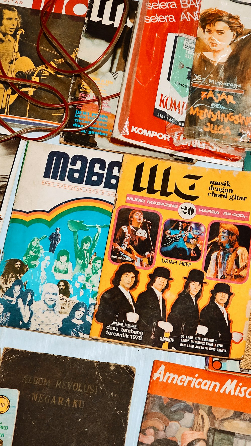 a pile of magazines sitting on top of a table