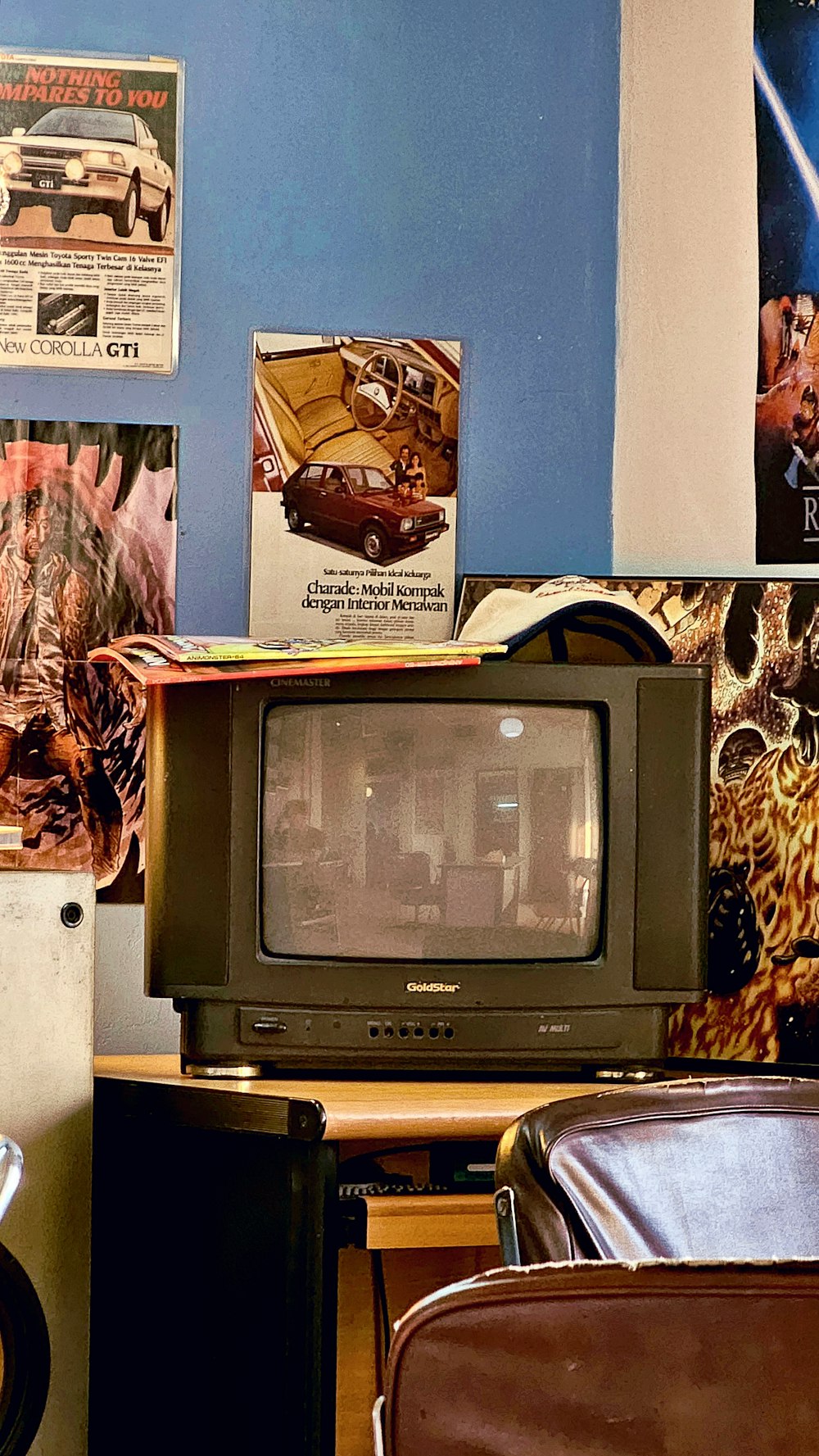 a television sitting on top of a wooden table