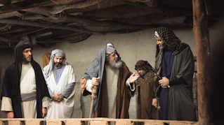 a group of men standing next to each other