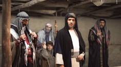 a group of men standing next to each other