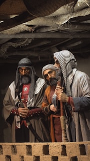 a group of men standing next to each other