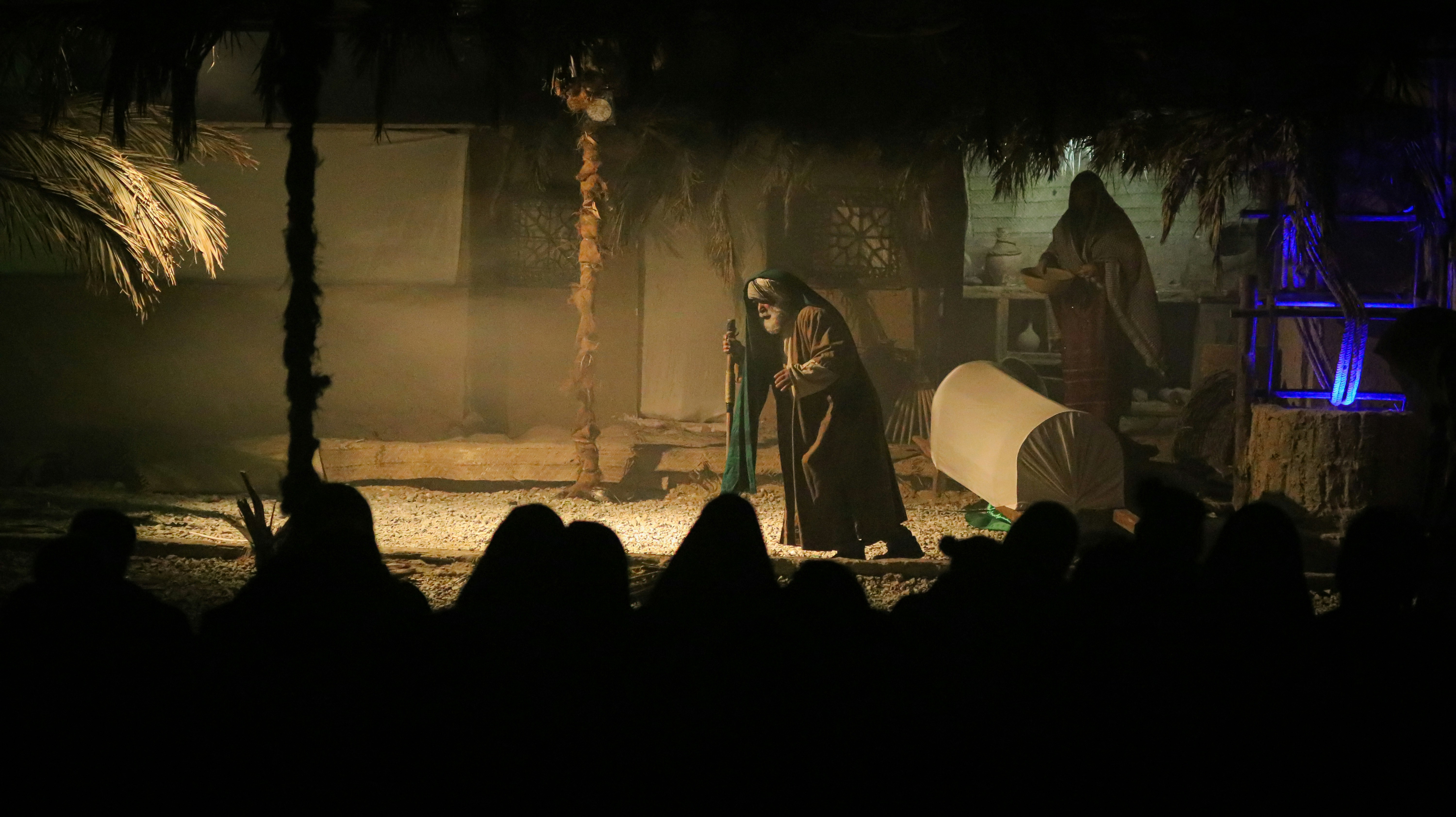 a group of people standing around a stage