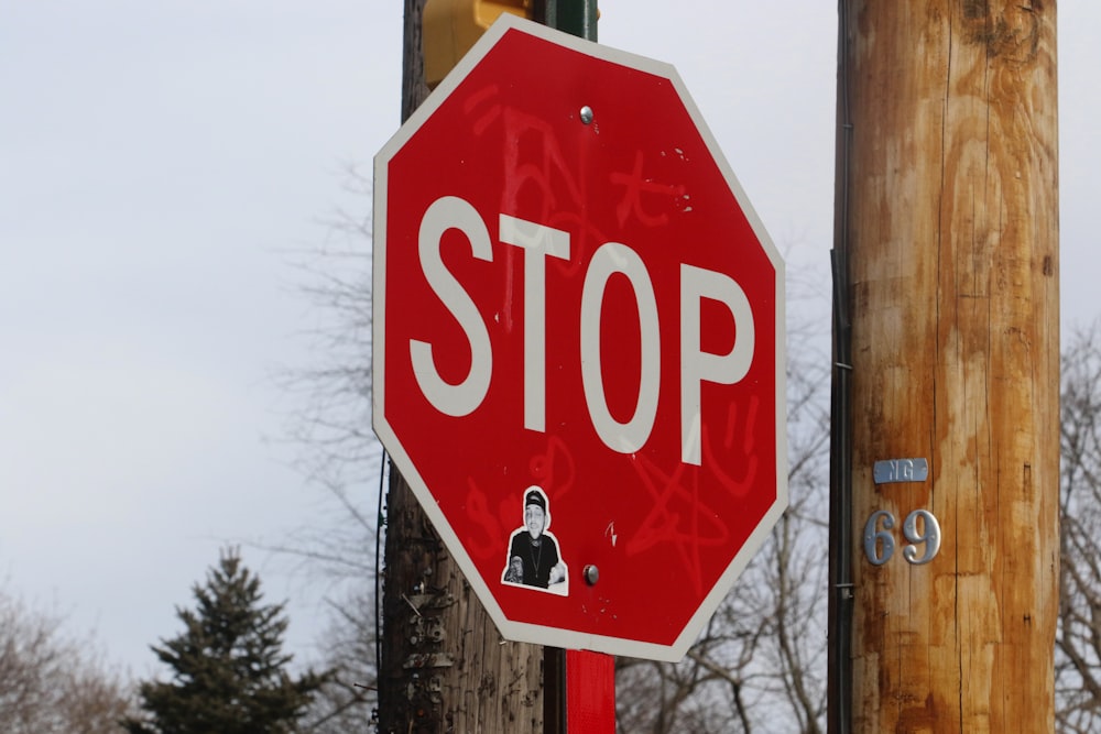 a stop sign with a sticker on it