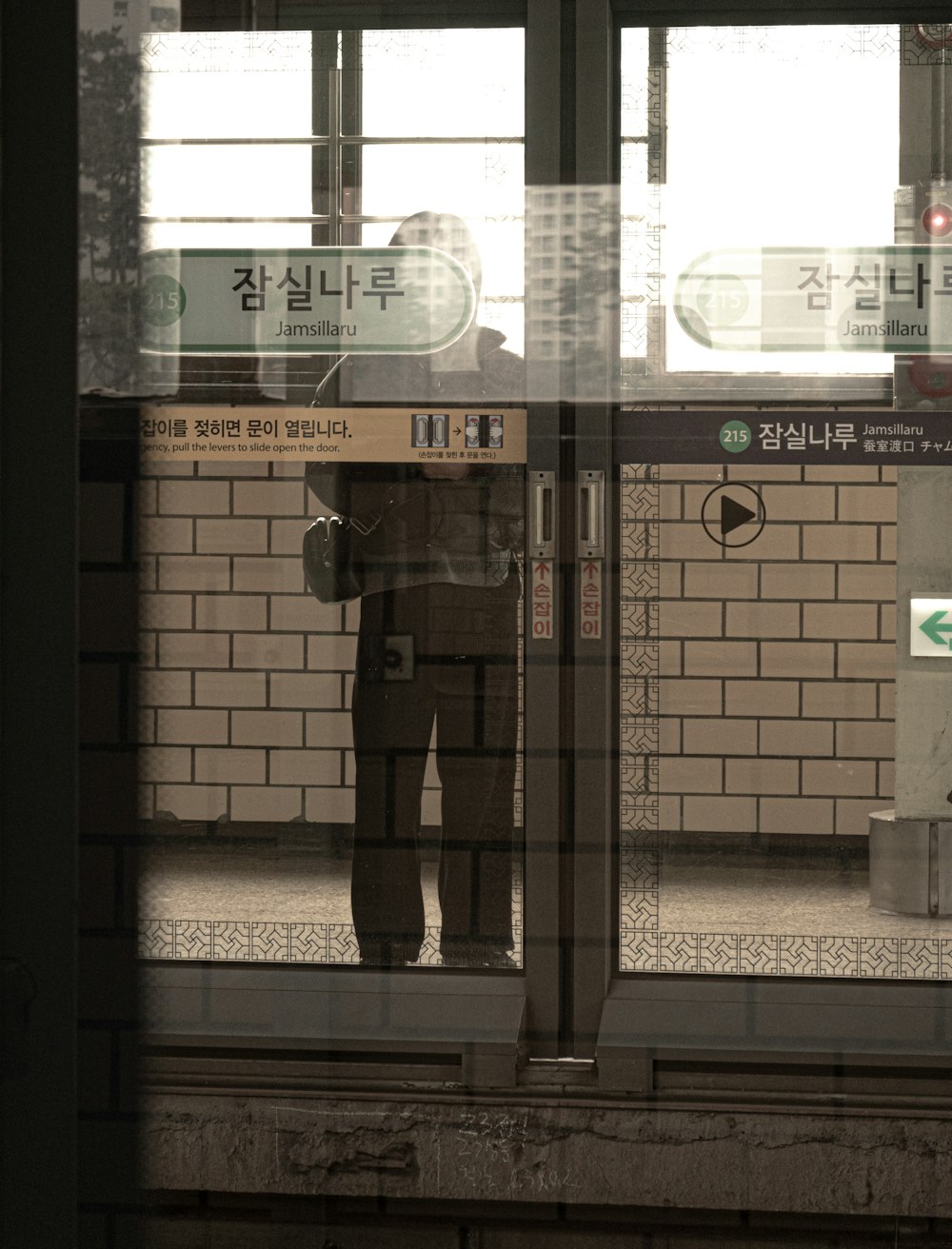 a man standing in front of a train station