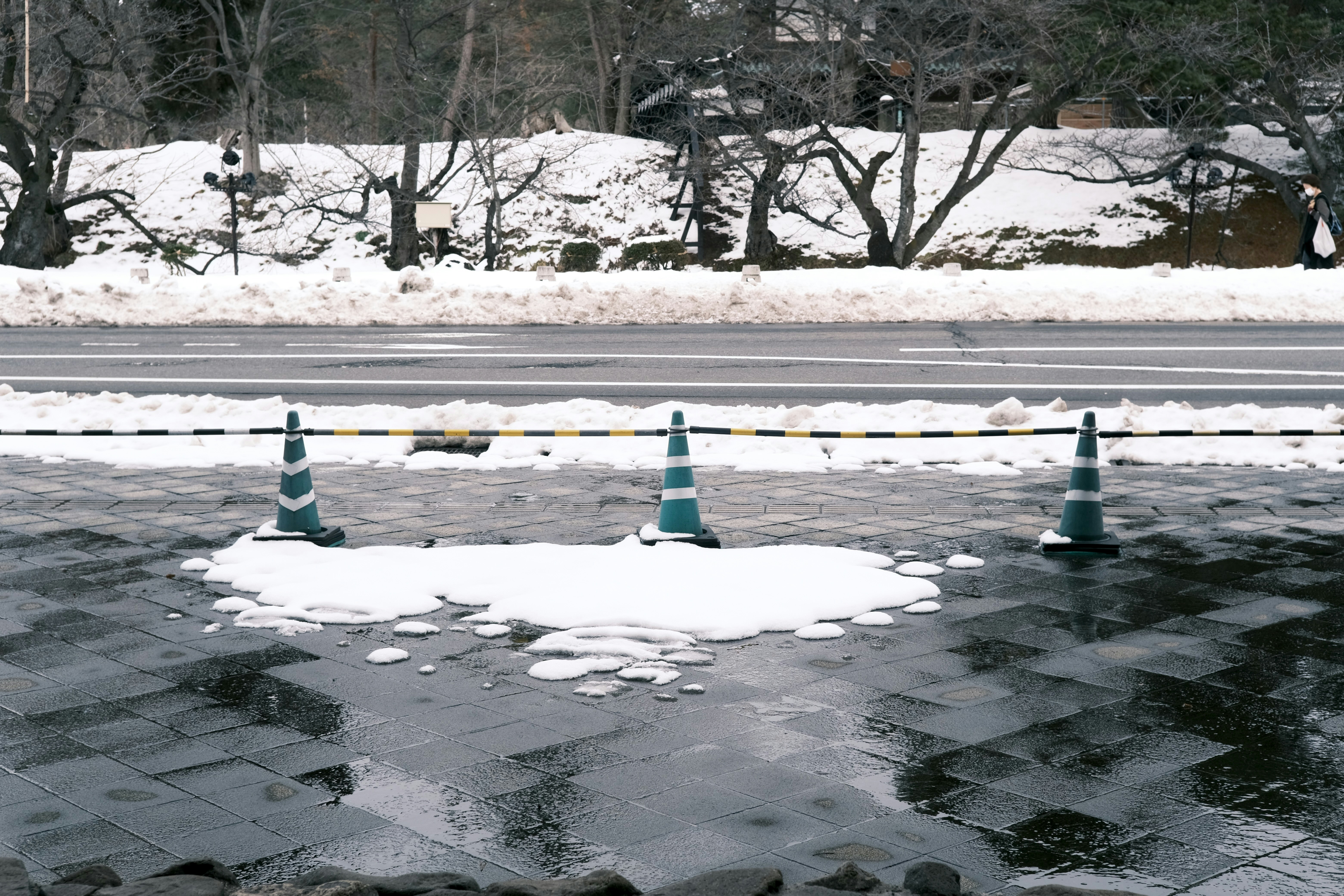 a street that has some snow on it