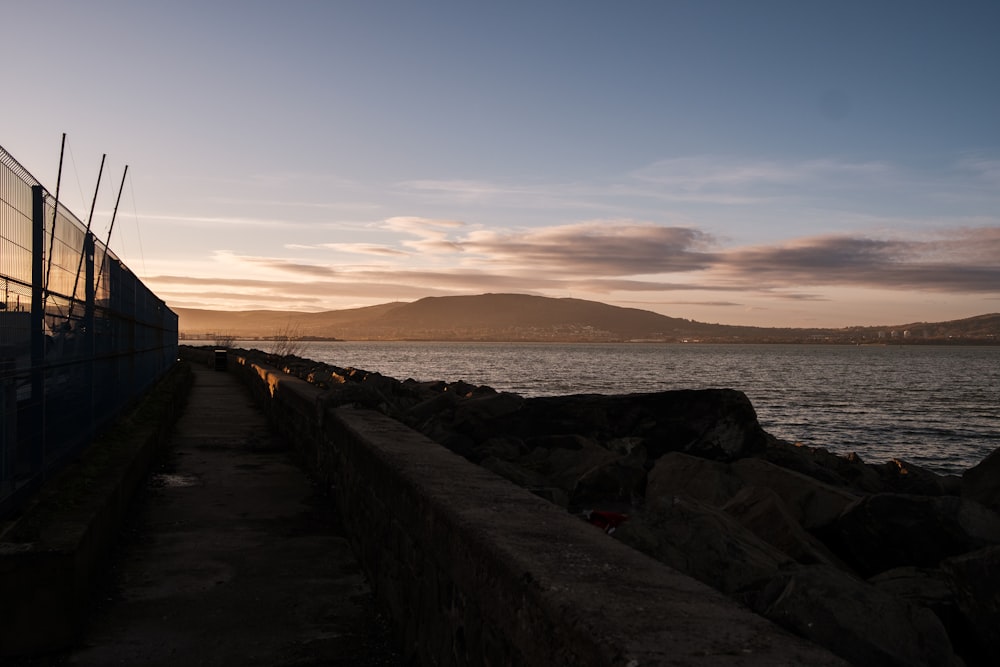 a view of a body of water at sunset