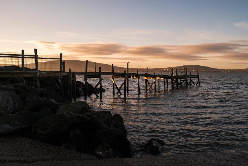 a pier on the shore of a body of water