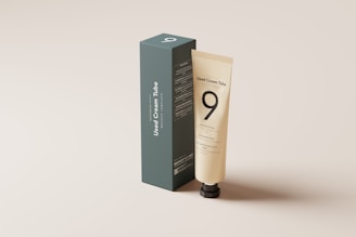 a tube of lotion sitting in front of a box