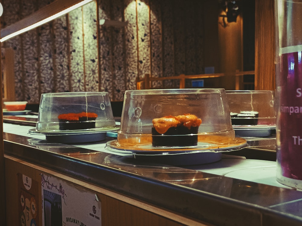 a counter with plates of food on it