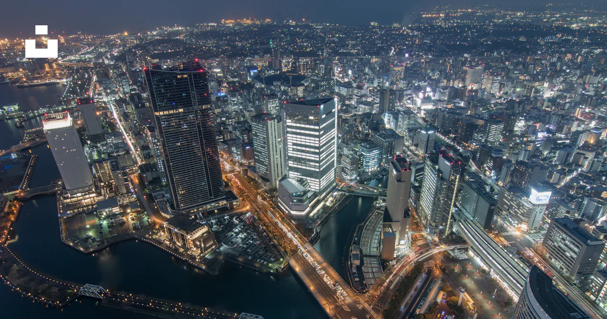 An aerial view of a city at night photo – Free Cityscape Image on Unsplash