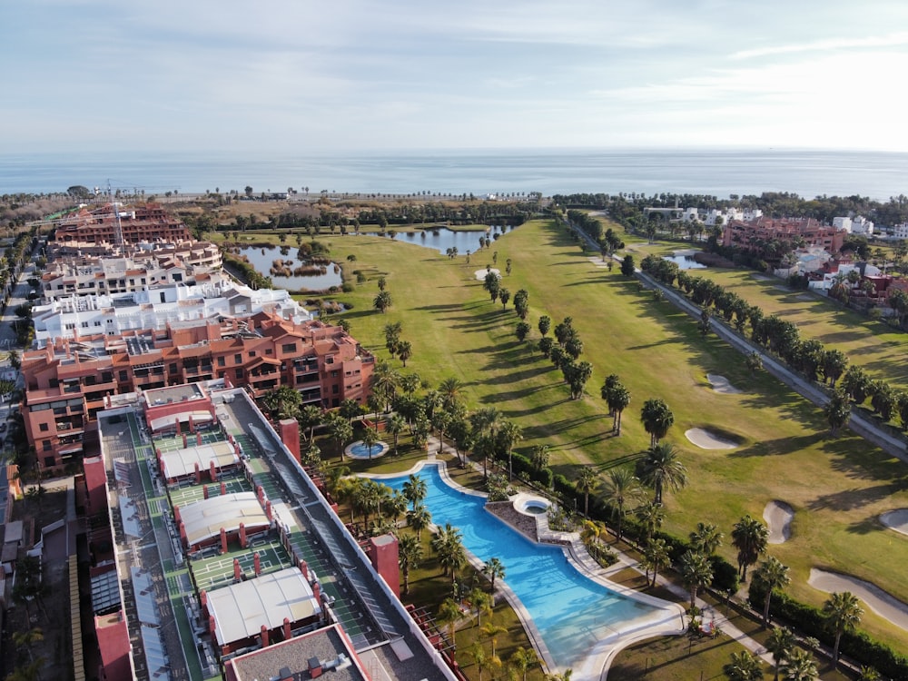 a bird's eye view of a resort with a swimming pool