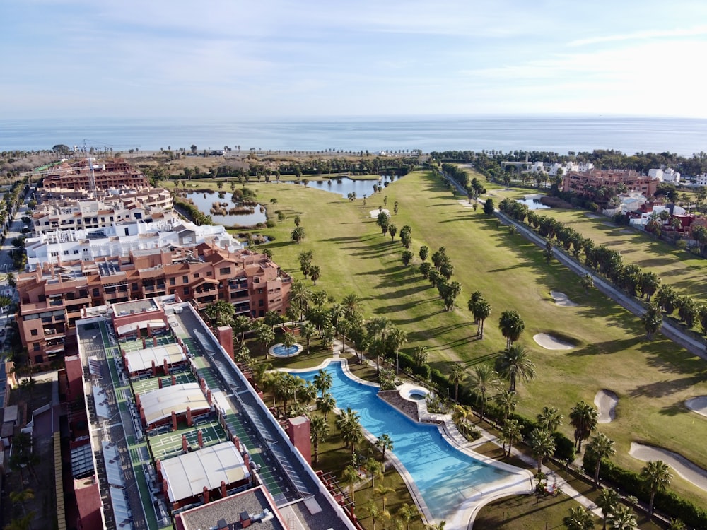 an aerial view of a golf course and a resort