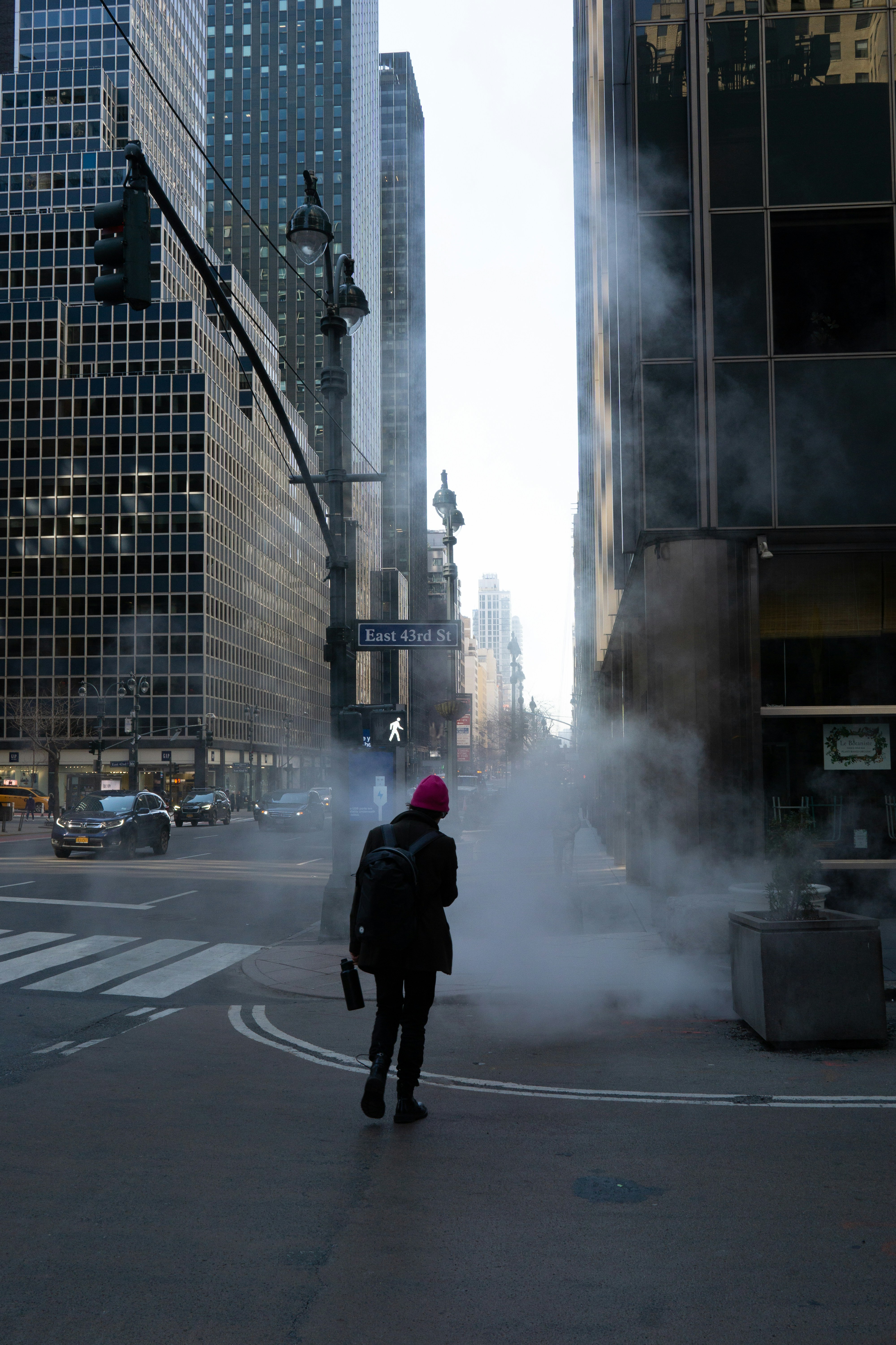 a person standing in the middle of a street