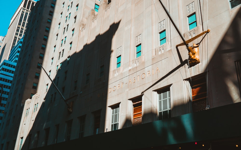 a tall building with a traffic light in front of it