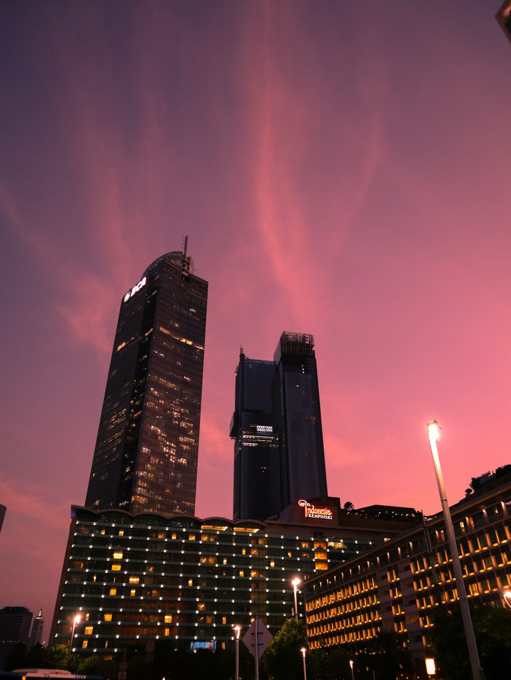 a very tall building sitting next to a very tall building