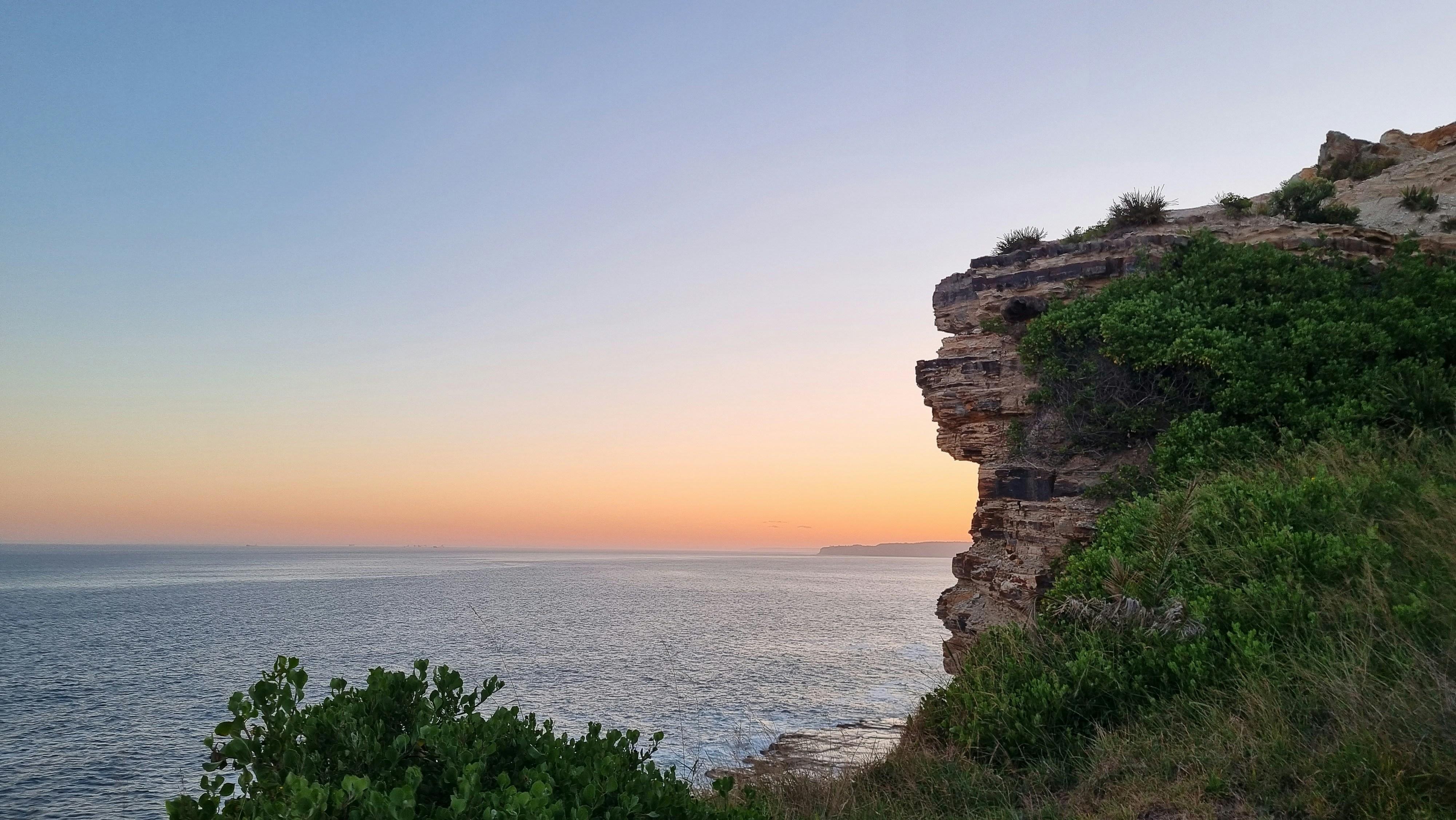 a view of the ocean from a cliff