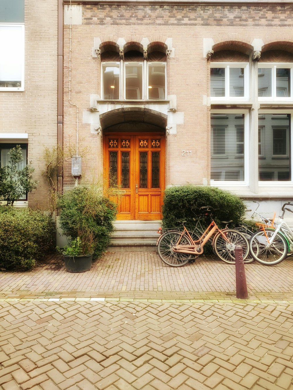 a couple of bikes parked in front of a building