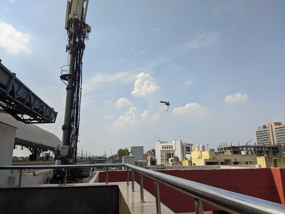 a large crane on top of a building with a sky background