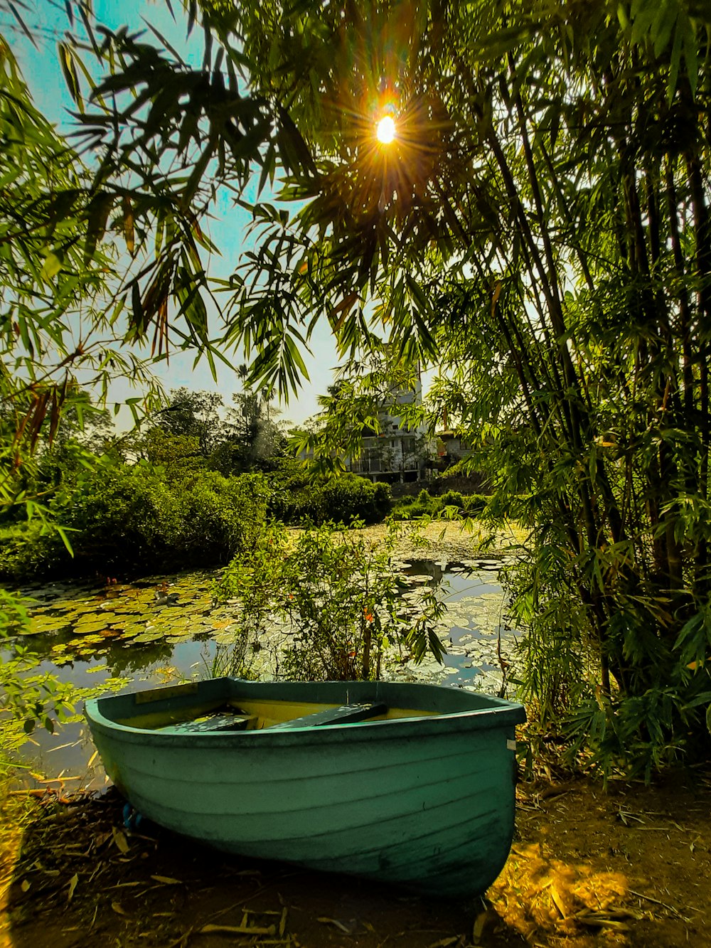 a small boat sitting on the shore of a lake