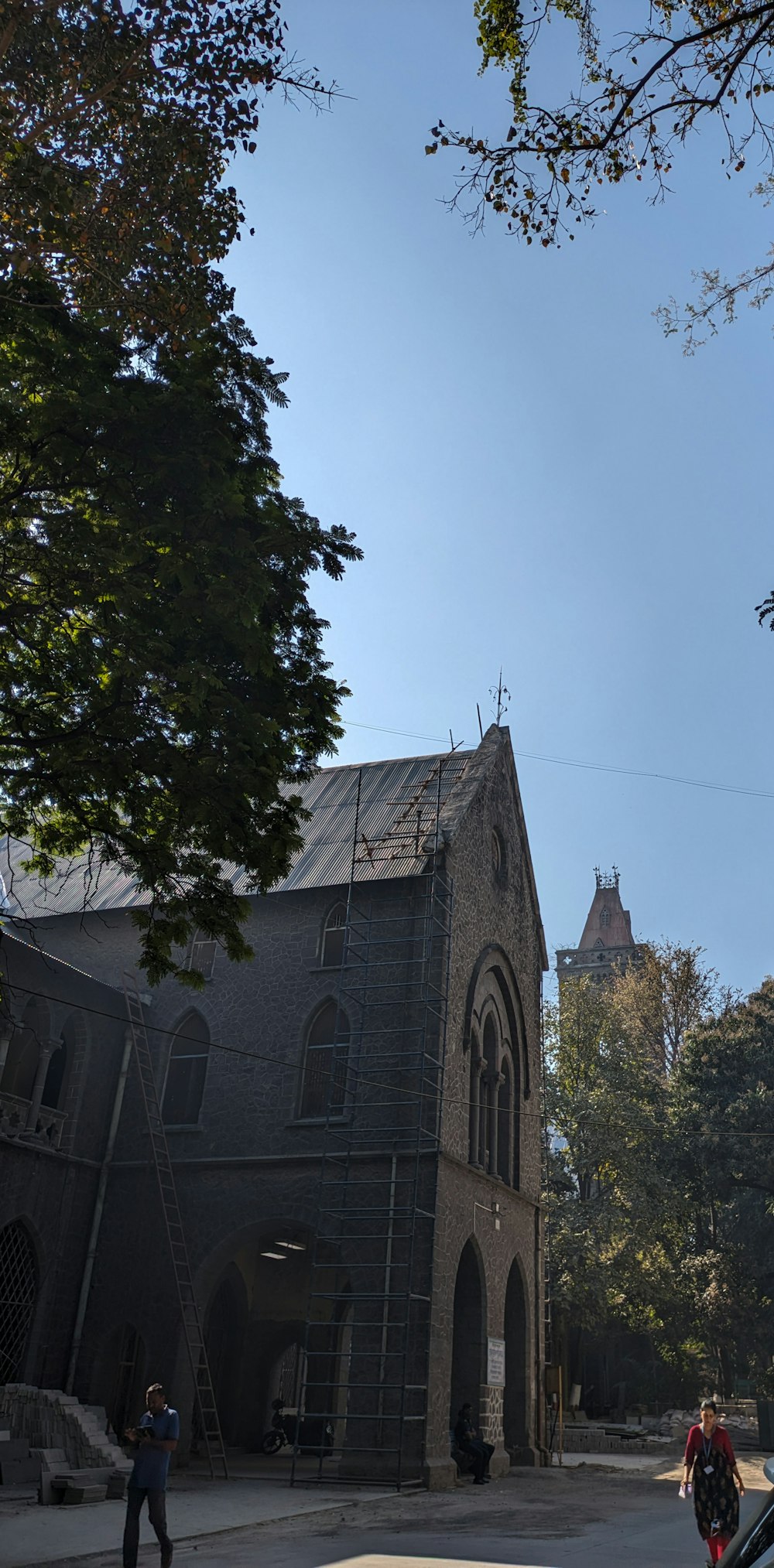 a church with a steeple on a sunny day