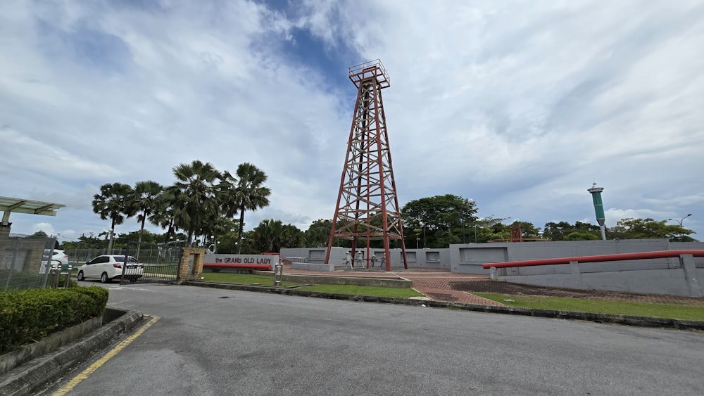 a tall tower sitting on the side of a road