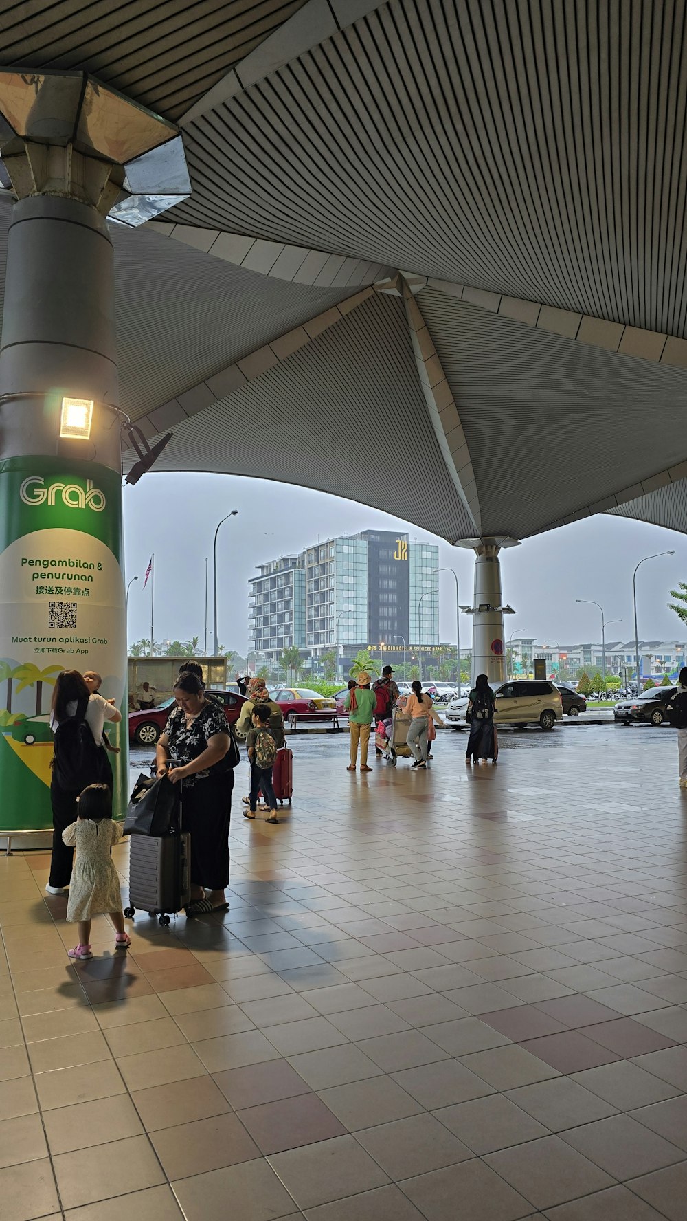 a group of people standing around a train station