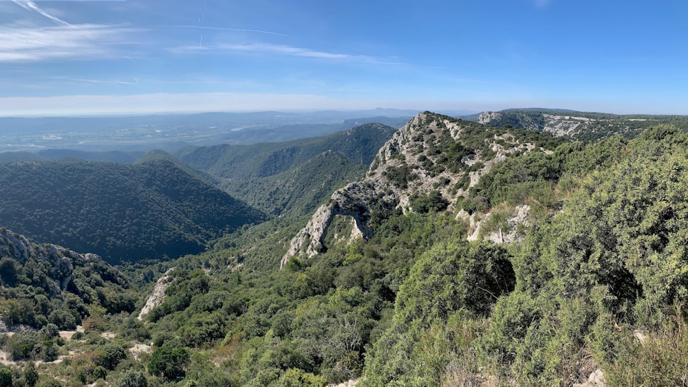 a view of the mountains and valleys from the top of a hill