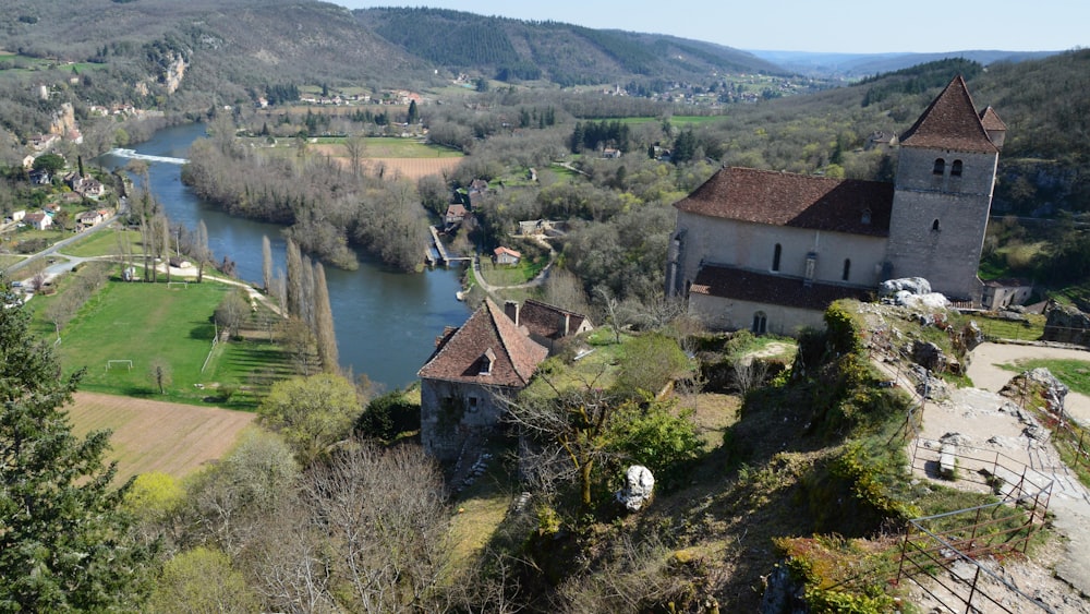 an aerial view of a castle and a river