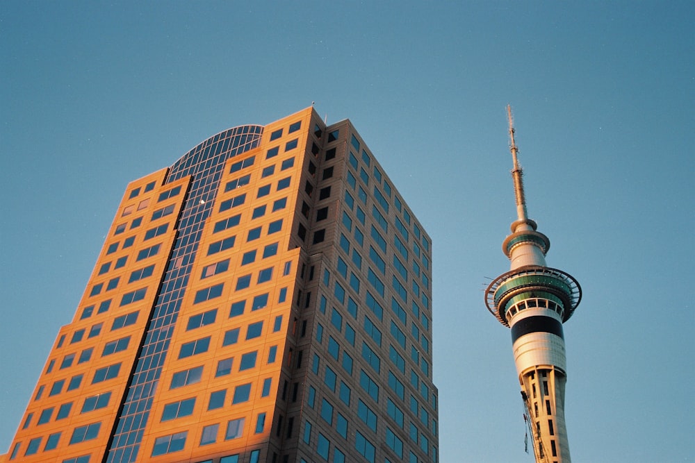 a tall building next to a tall skyscraper