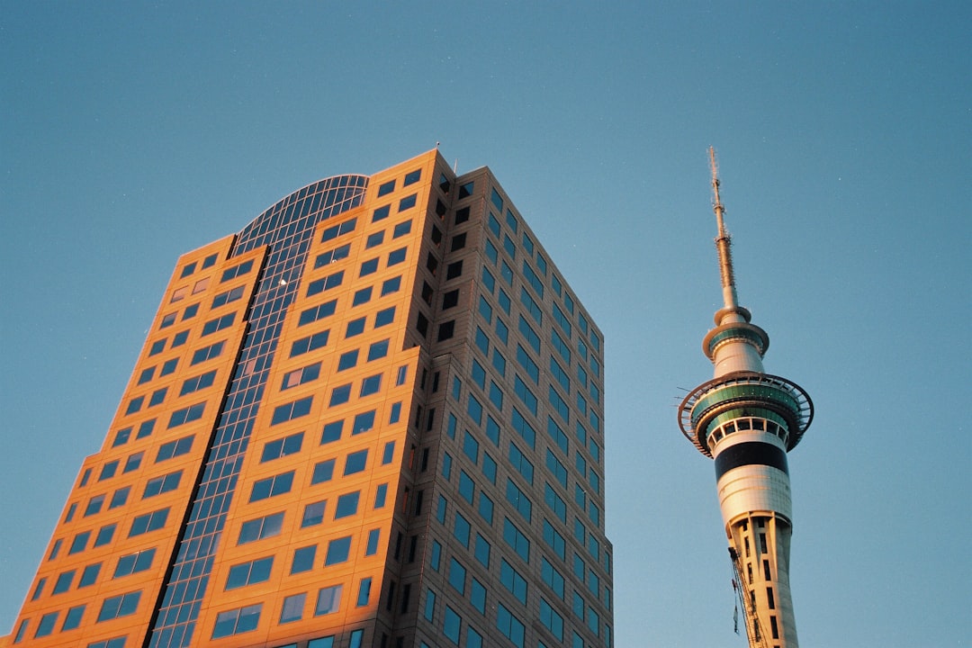 a tall building next to a tall skyscraper,