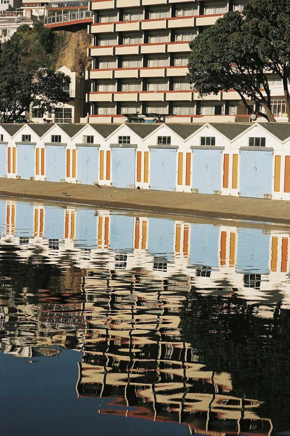 a large body of water with a building in the background