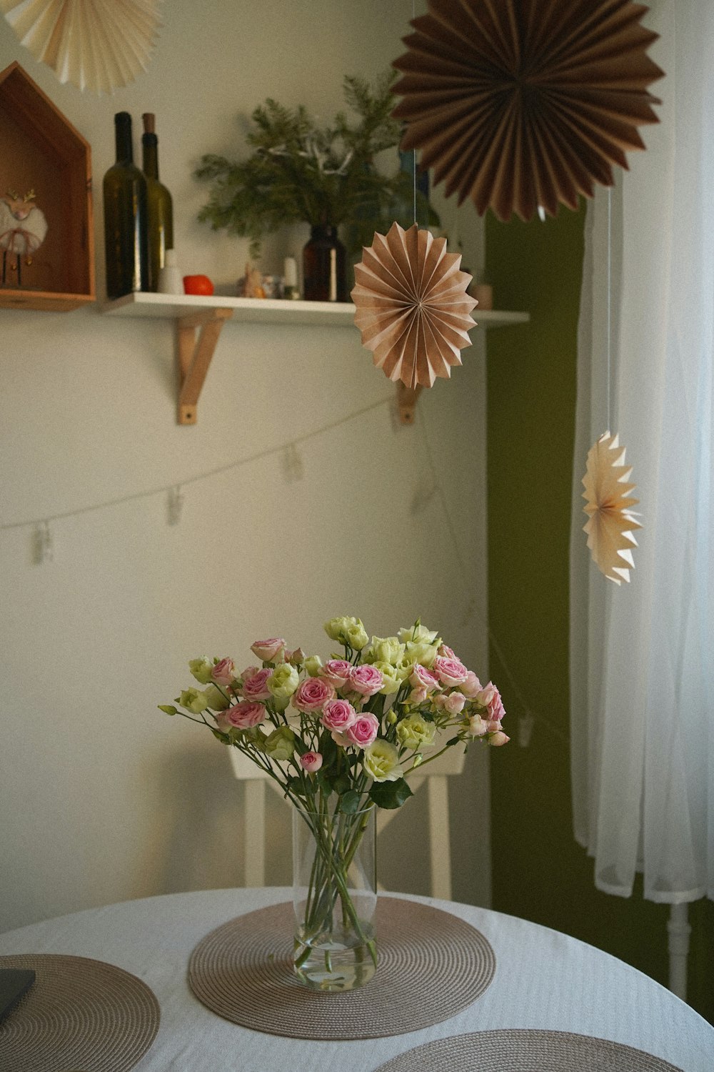 a vase of flowers sitting on top of a table