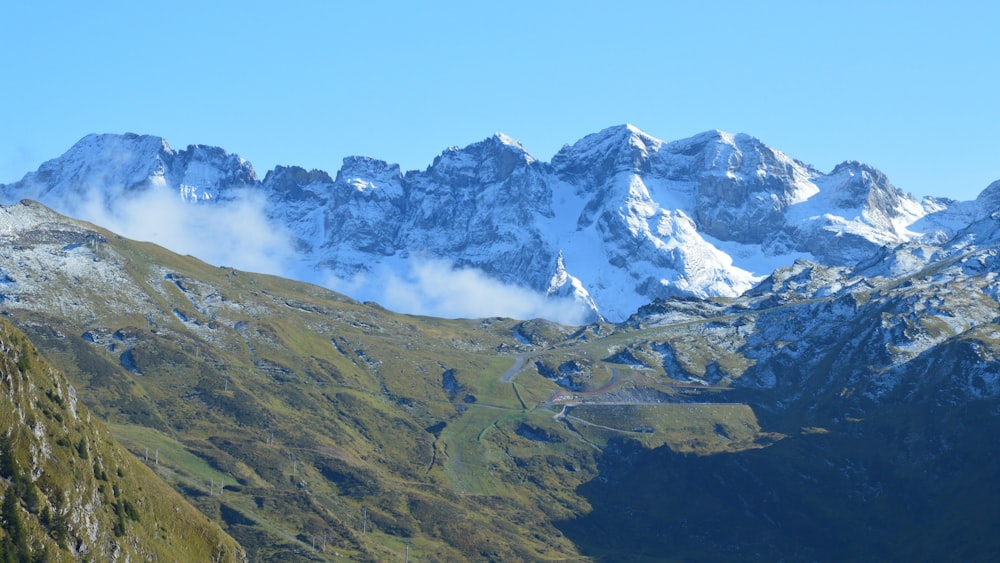 a view of a mountain range with snow on the top