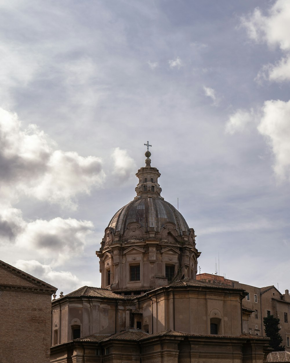 a large building with a cross on top of it