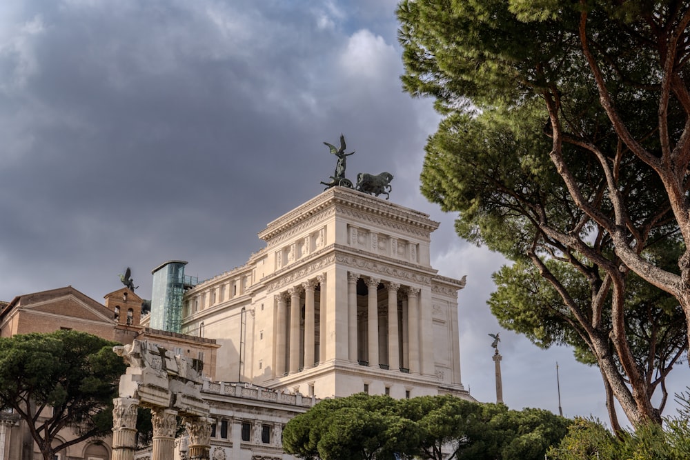 a tall building with a statue on top of it