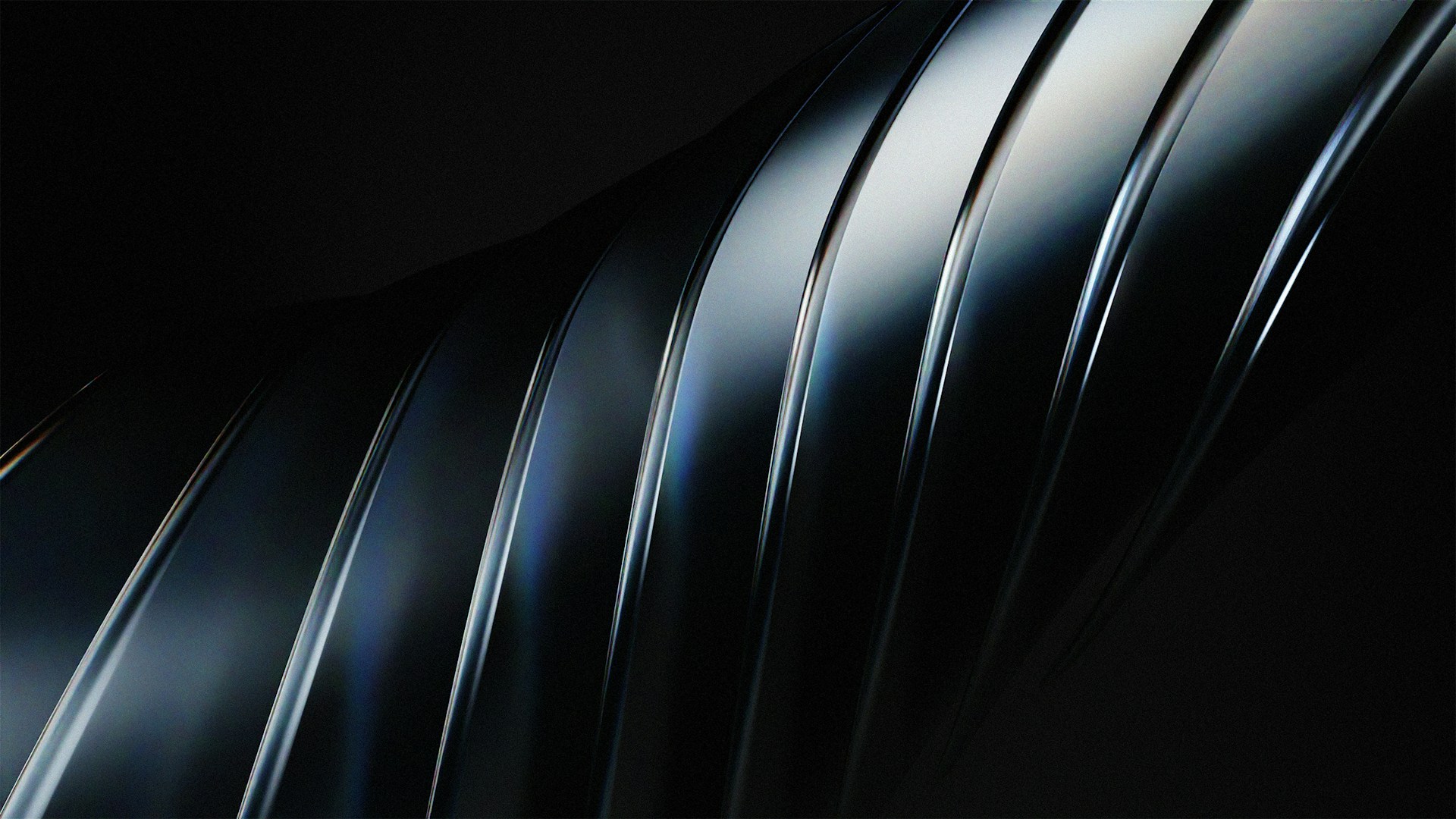 a close up of a metal object with a black background
