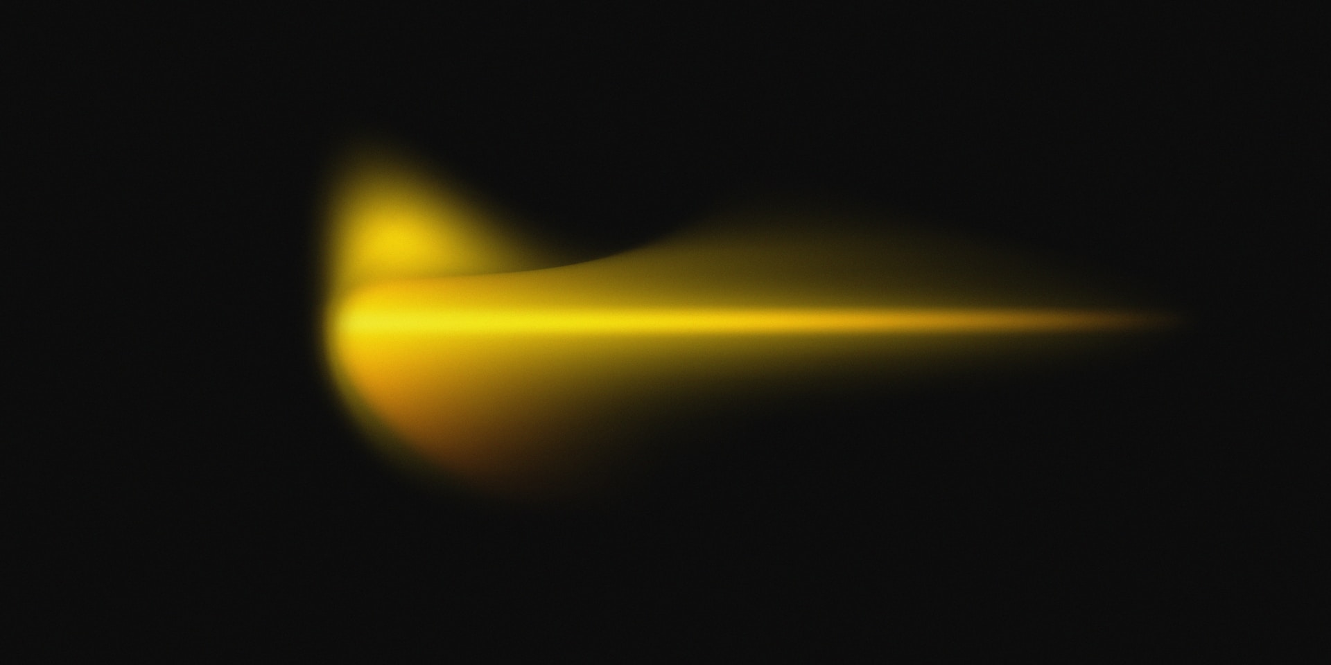 a blurry image of a yellow object in the dark