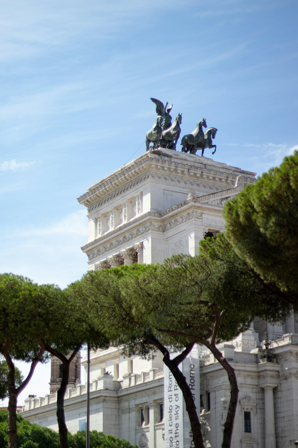 a statue of a man on a horse on top of a building