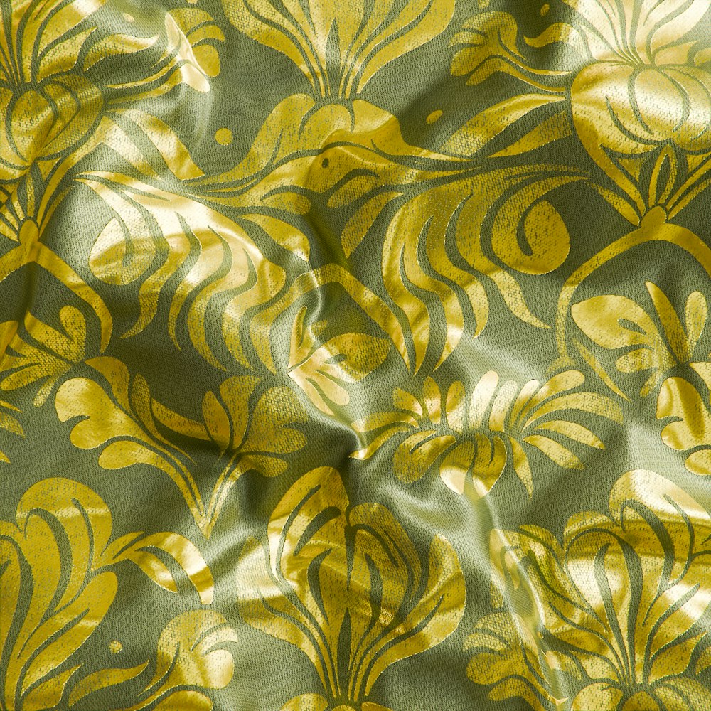 a close up of a yellow and green fabric