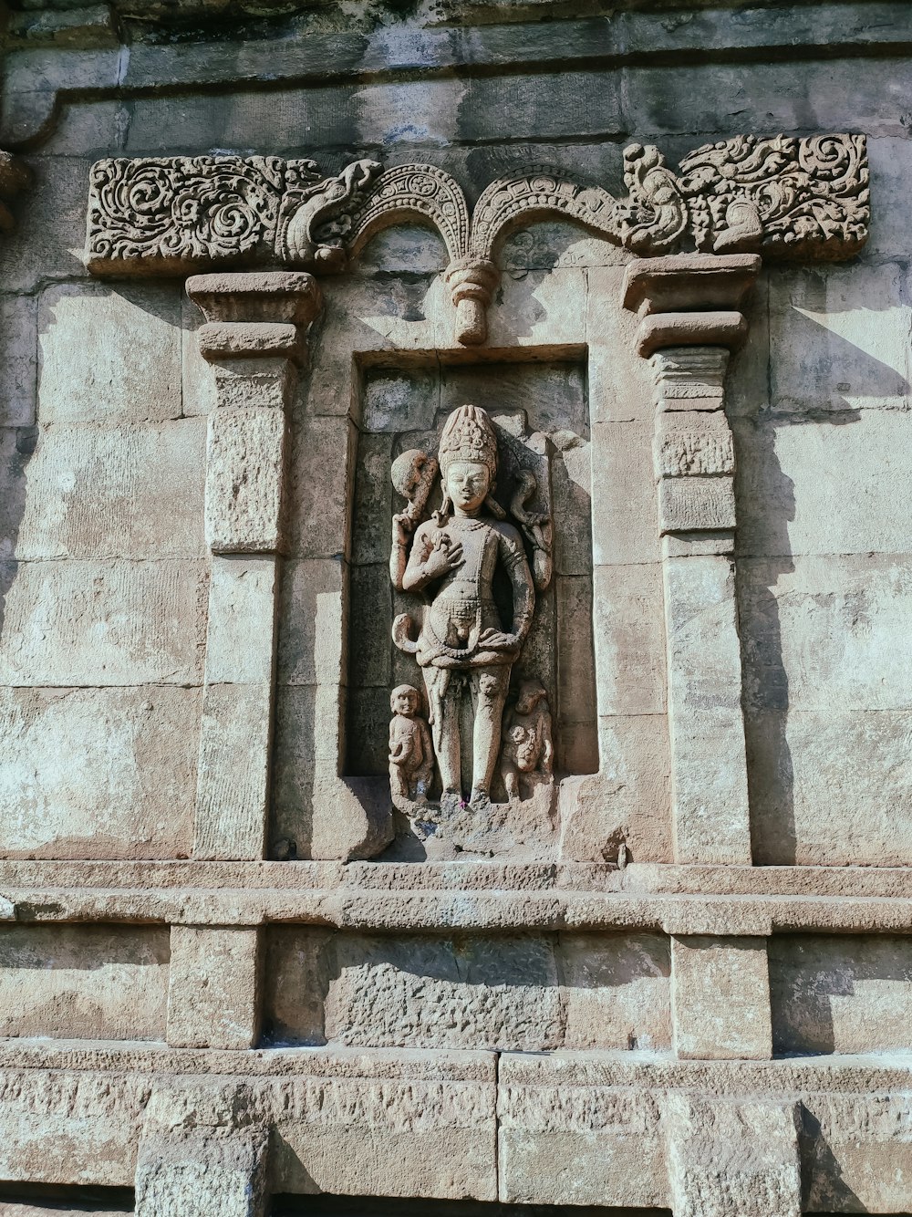 a statue of a person holding a child