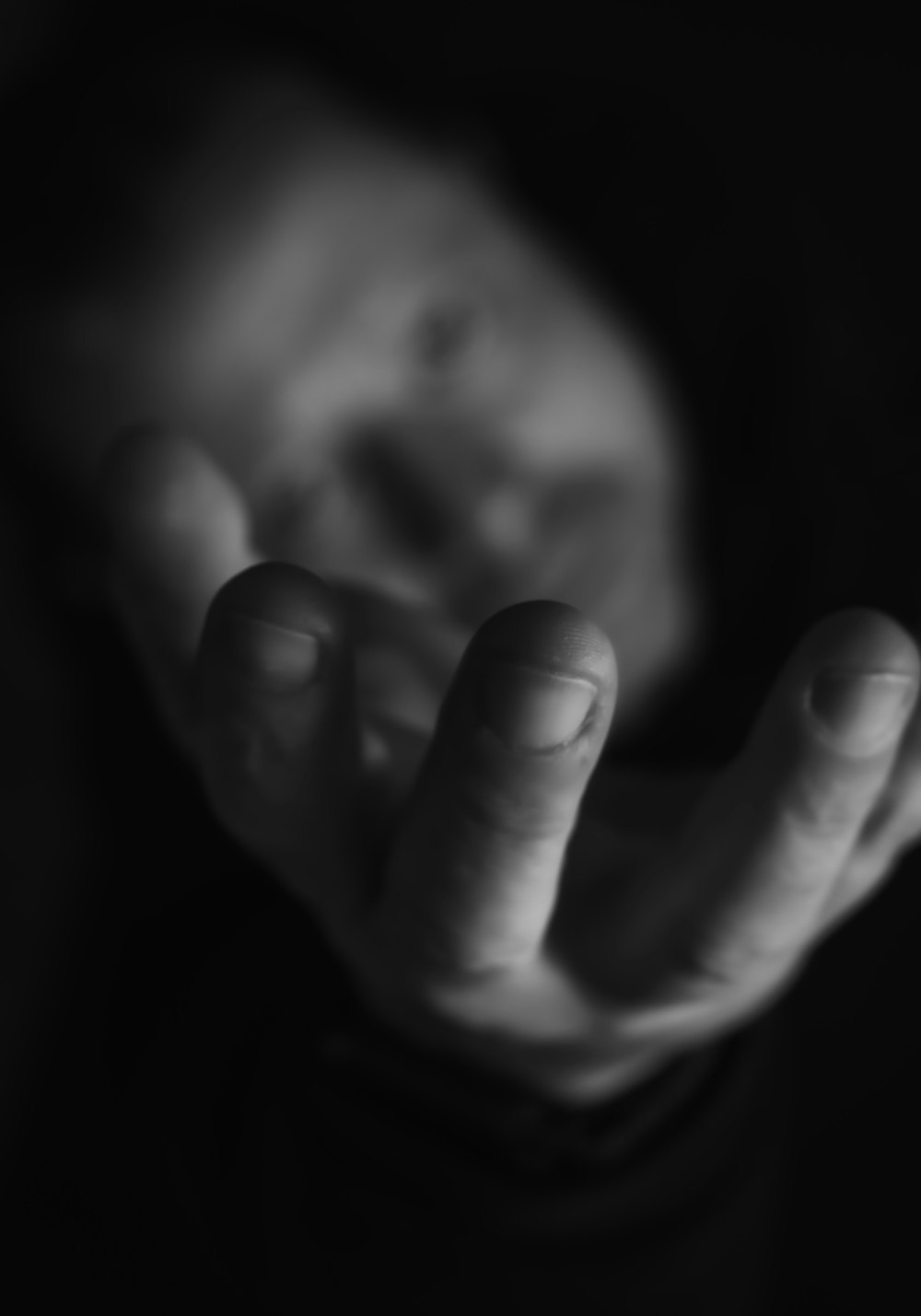 a black and white photo of a person's hands