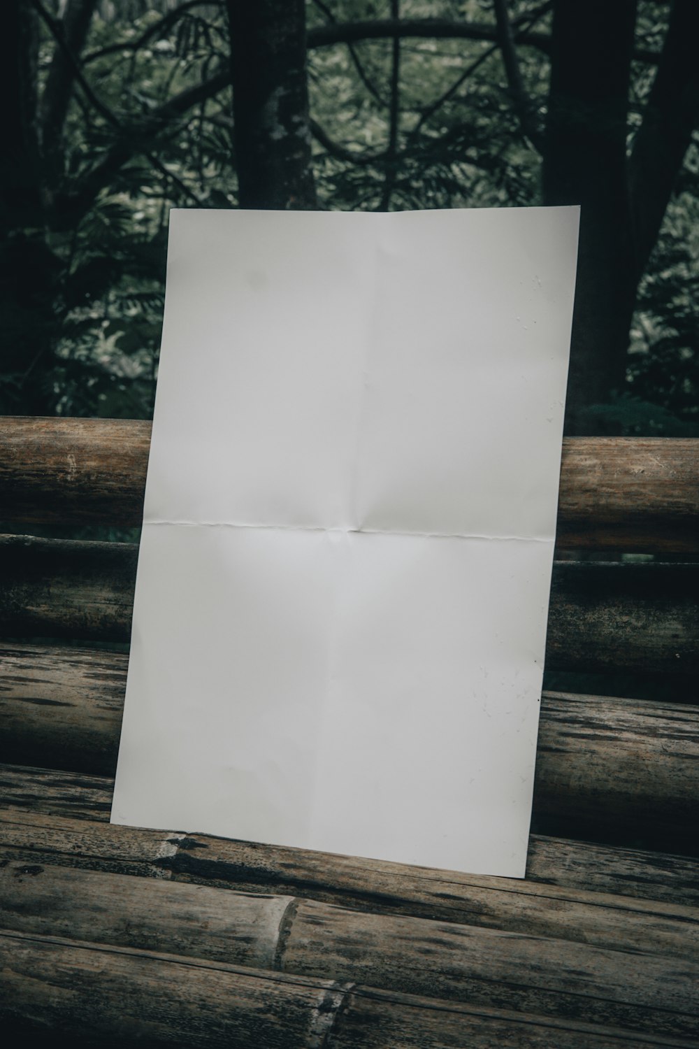 a piece of paper sitting on top of a wooden table
