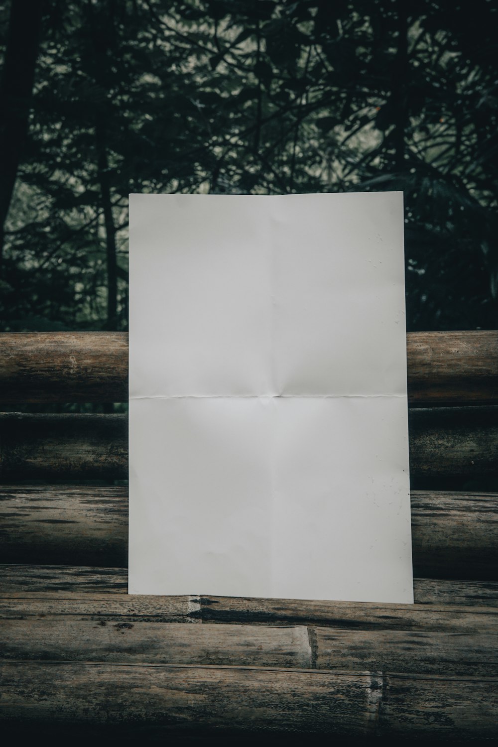 a piece of paper sitting on top of a wooden table