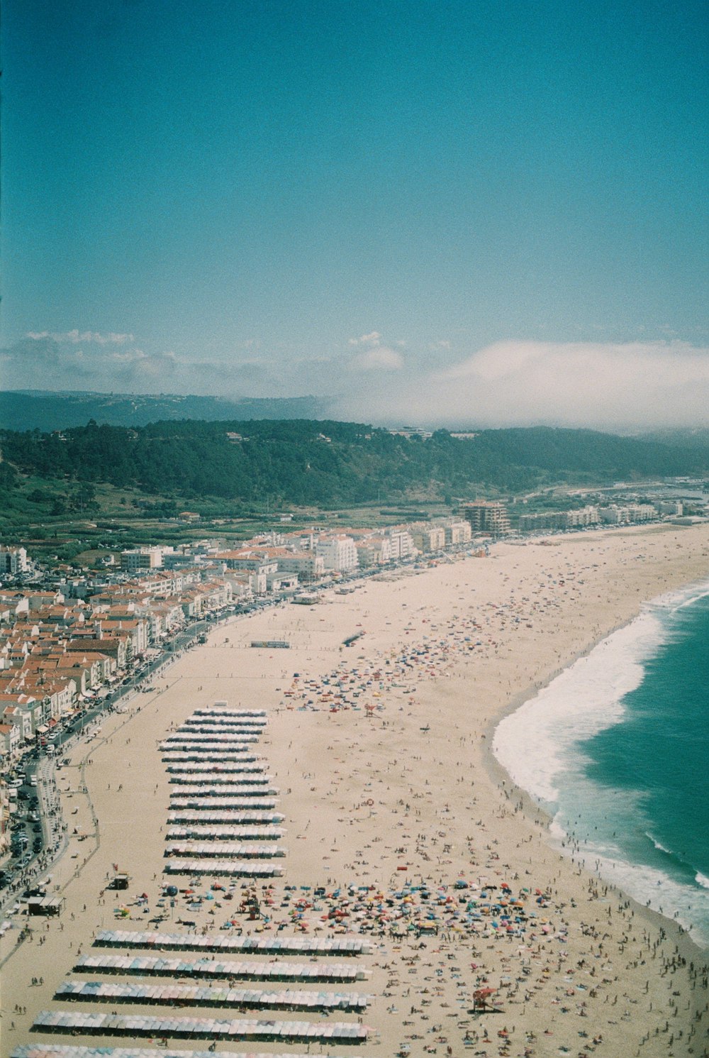 a beach with a lot of people on it