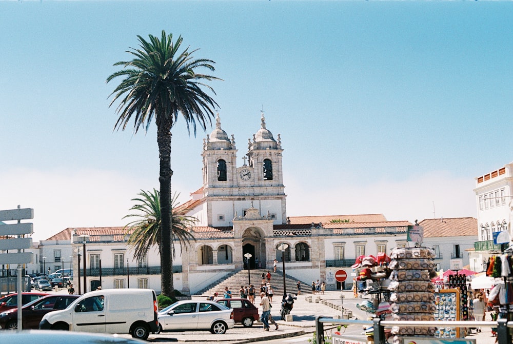 a group of cars parked in front of a church