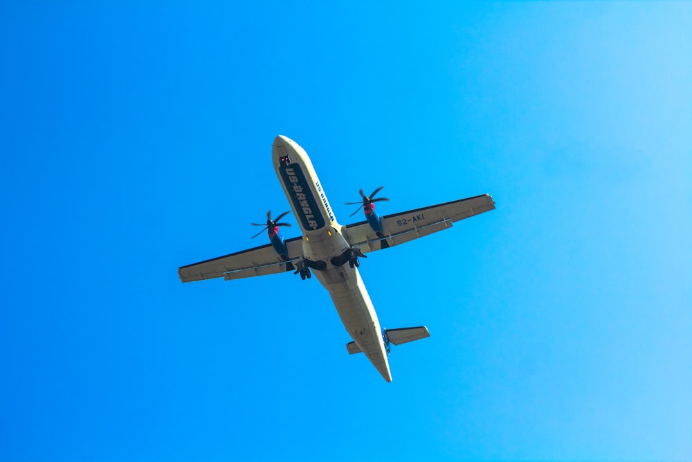 a large passenger jet flying through a blue sky