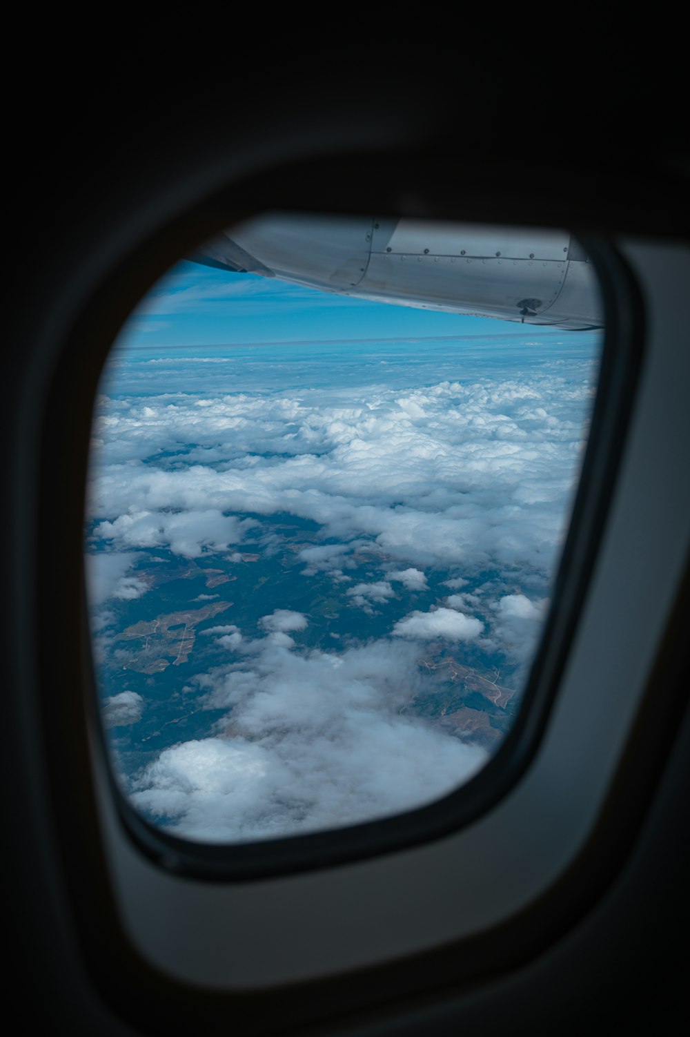 the view out of an airplane window of the clouds