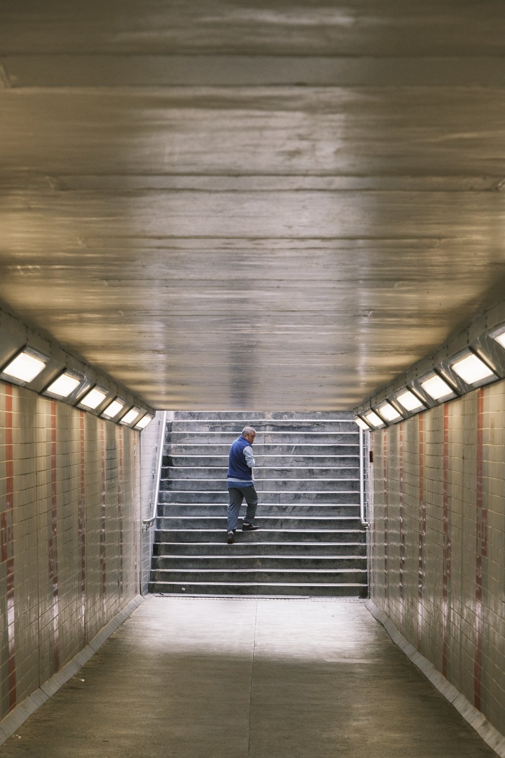 a man walking down a flight of stairs