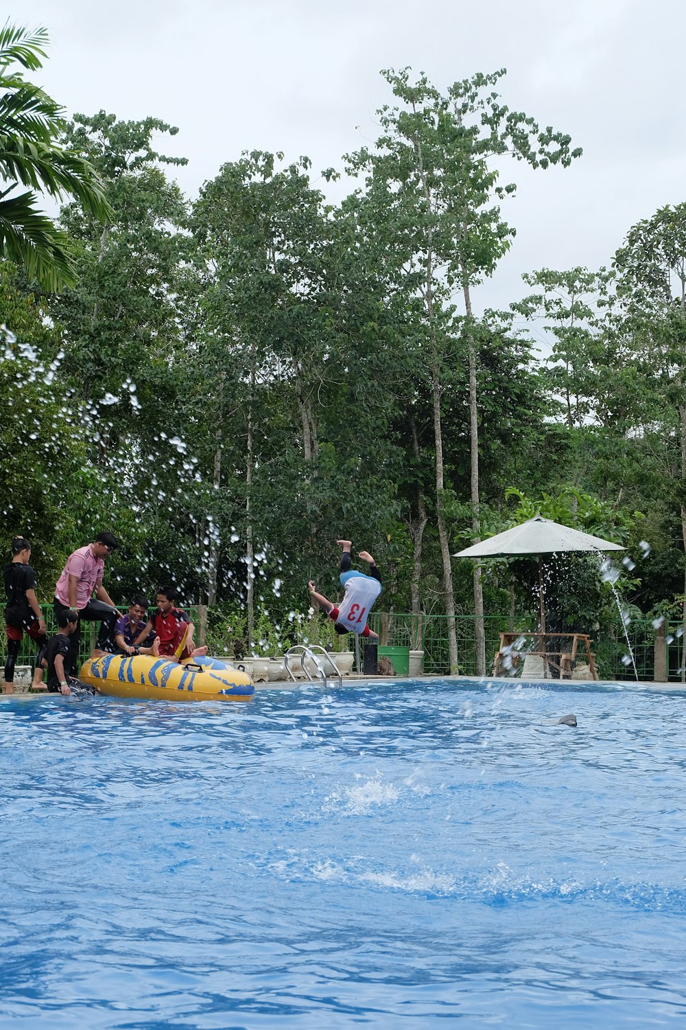 a group of people playing in a swimming pool