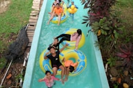 a group of people riding on top of an inflatable raft